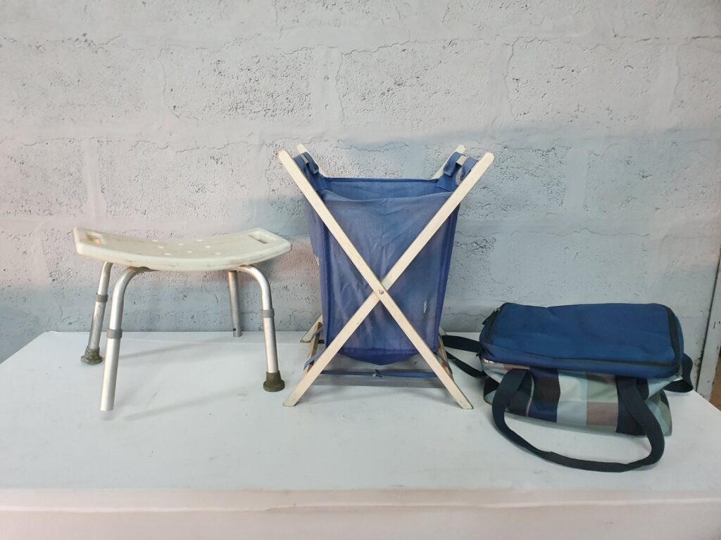 Mixed household lot: adjustable shower stool + wooden X-frame laundry hamper + soft bags — used, faults