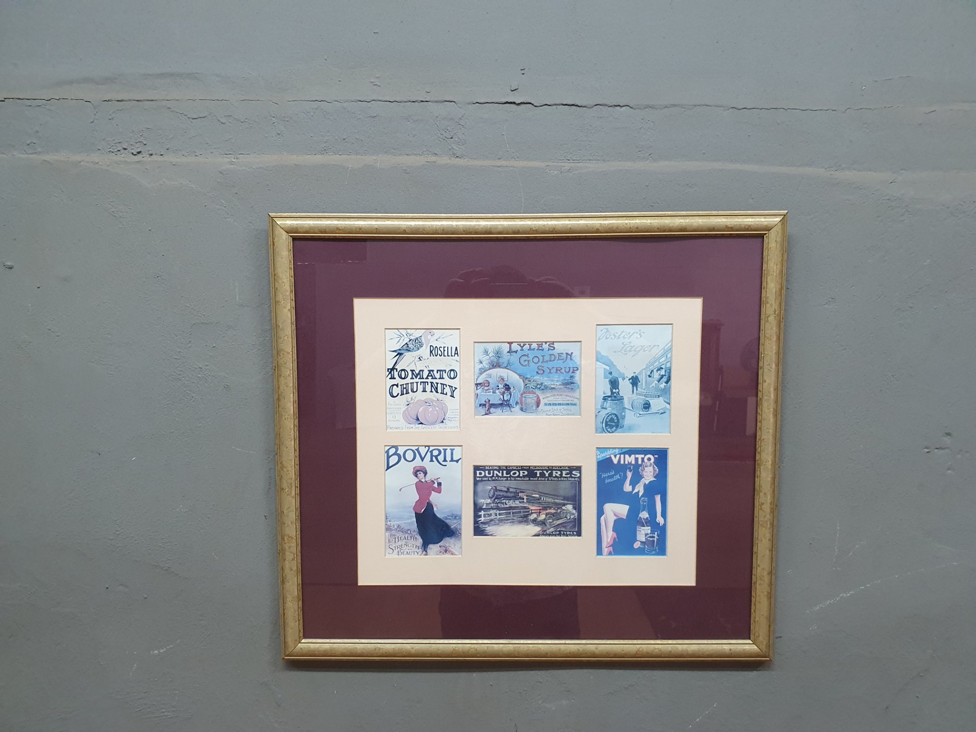 Framed collage of vintage advertising prints — gilt moulded frame, double mount, 59 x 69 cm