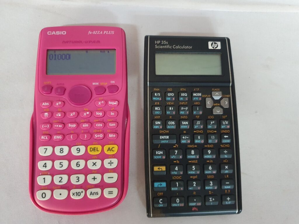 Lot: Casio fx-82ZA PLUS (pink) + HP 35s scientific calculator — Casio powers on, HP not working