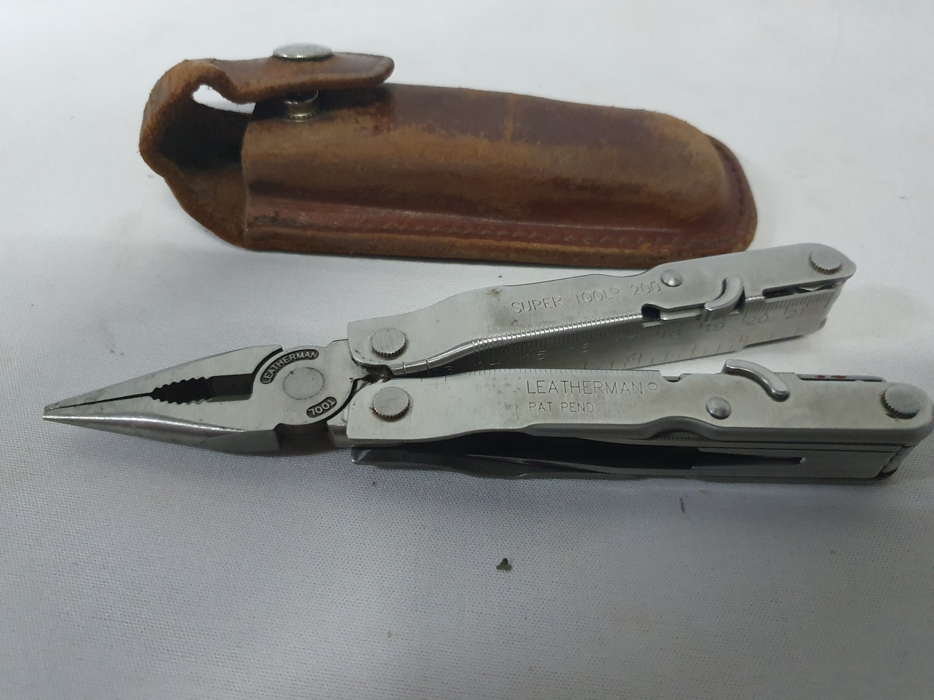 Leatherman Super Tool 200 stainless multi-tool with leather belt sheath
