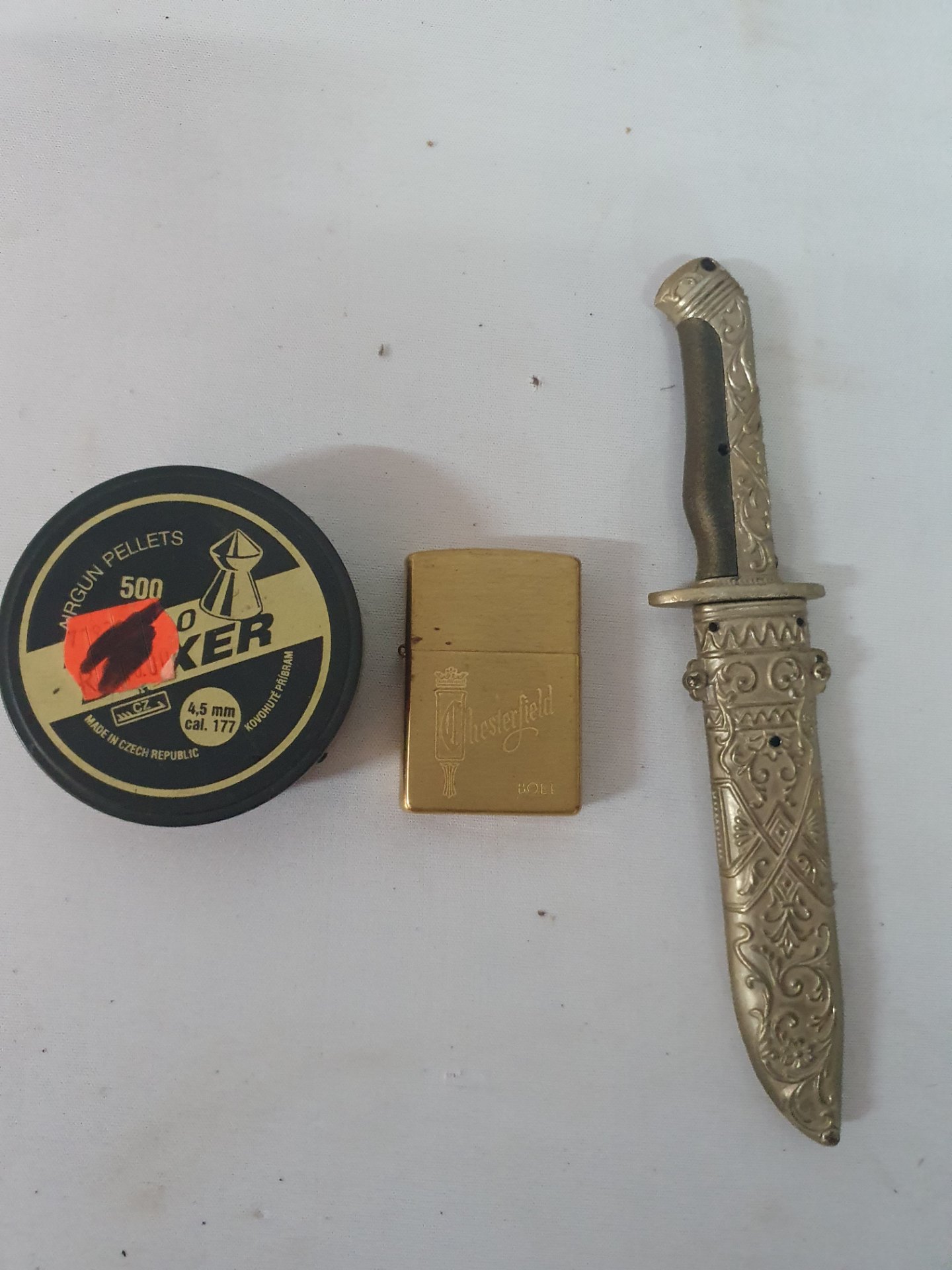 Mixed lot: decorative dagger with ornate sheath + Chesterfield/Zippo-style brass lighter (insert present) + tin .177 (4.5mm) airgun pellets