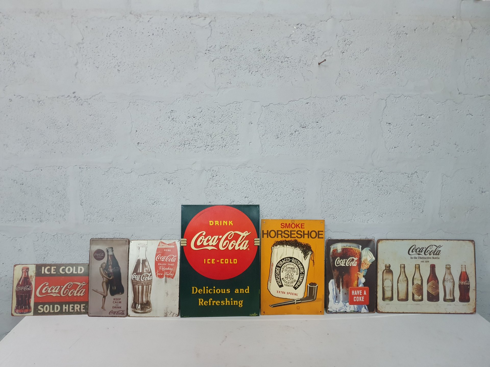 Lot of 7 Metal Advertising Signs — Coca‑Cola & Horseshoe Tobacco (reproduction, used)