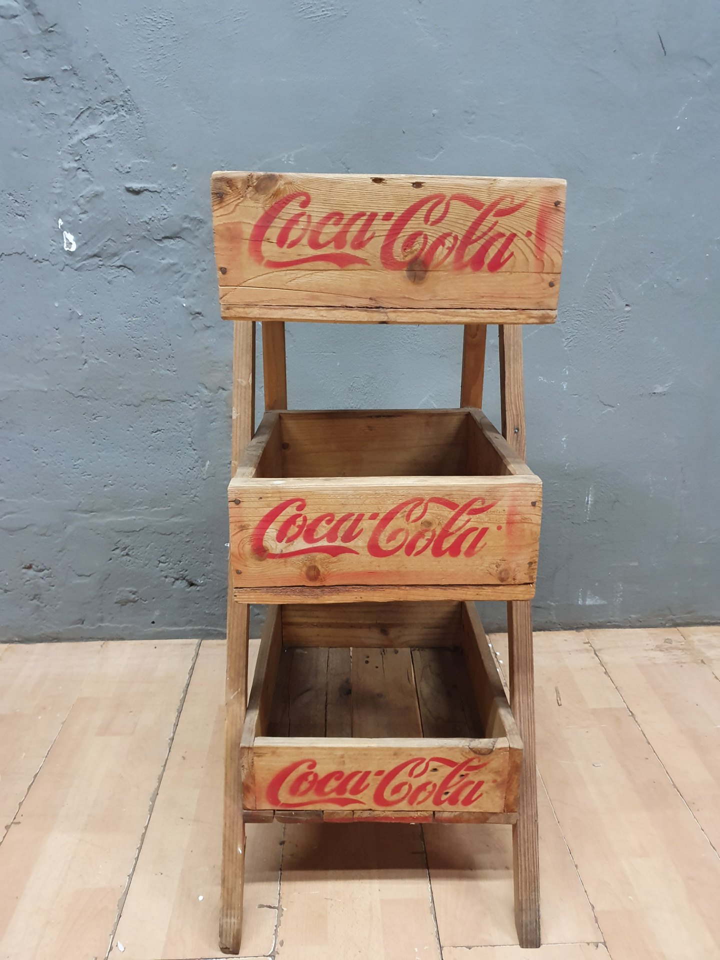 Three‑Tier Wooden Coca‑Cola Crate Display Stand — Stencilled Red Logo, Rustic Retail Unit