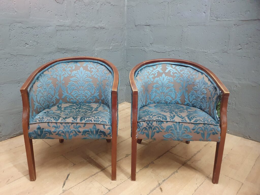 Pair of small tub / barrel armchairs — blue damask upholstery, wooden frame (sold as pair)