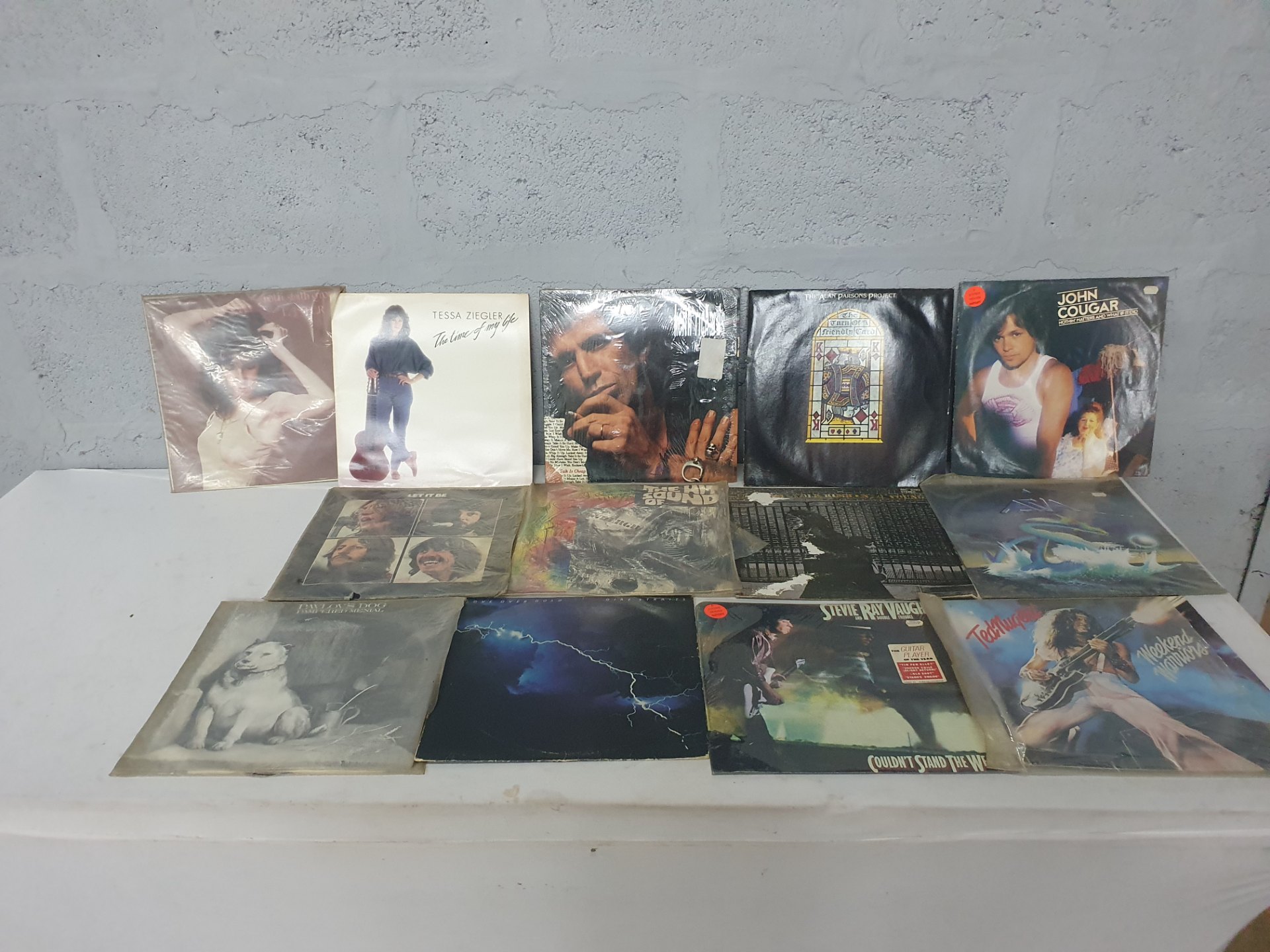 Mixed lot of assorted 12″ LP vinyl records — rock/pop collection, mixed sleeve condition, untested