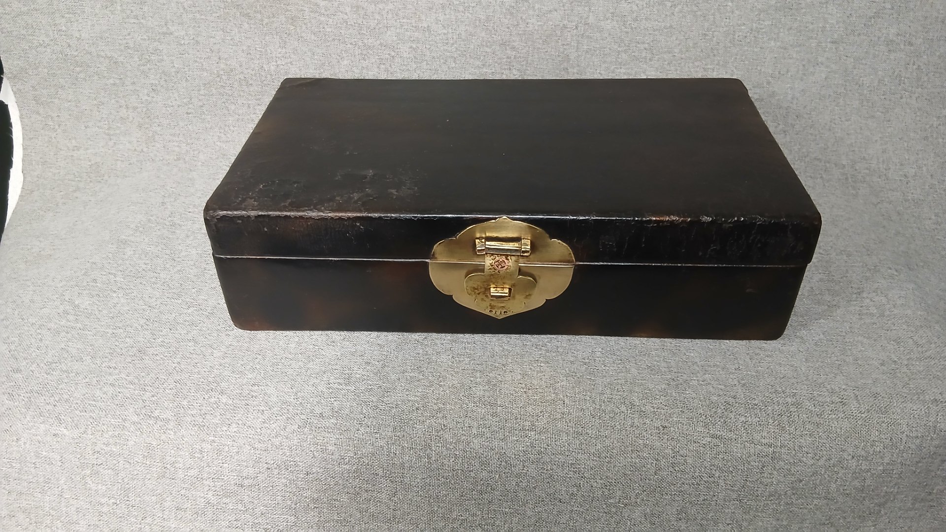 Dark lacquered storage box with brass latch & side handle — 35 x 19 x 9 cm