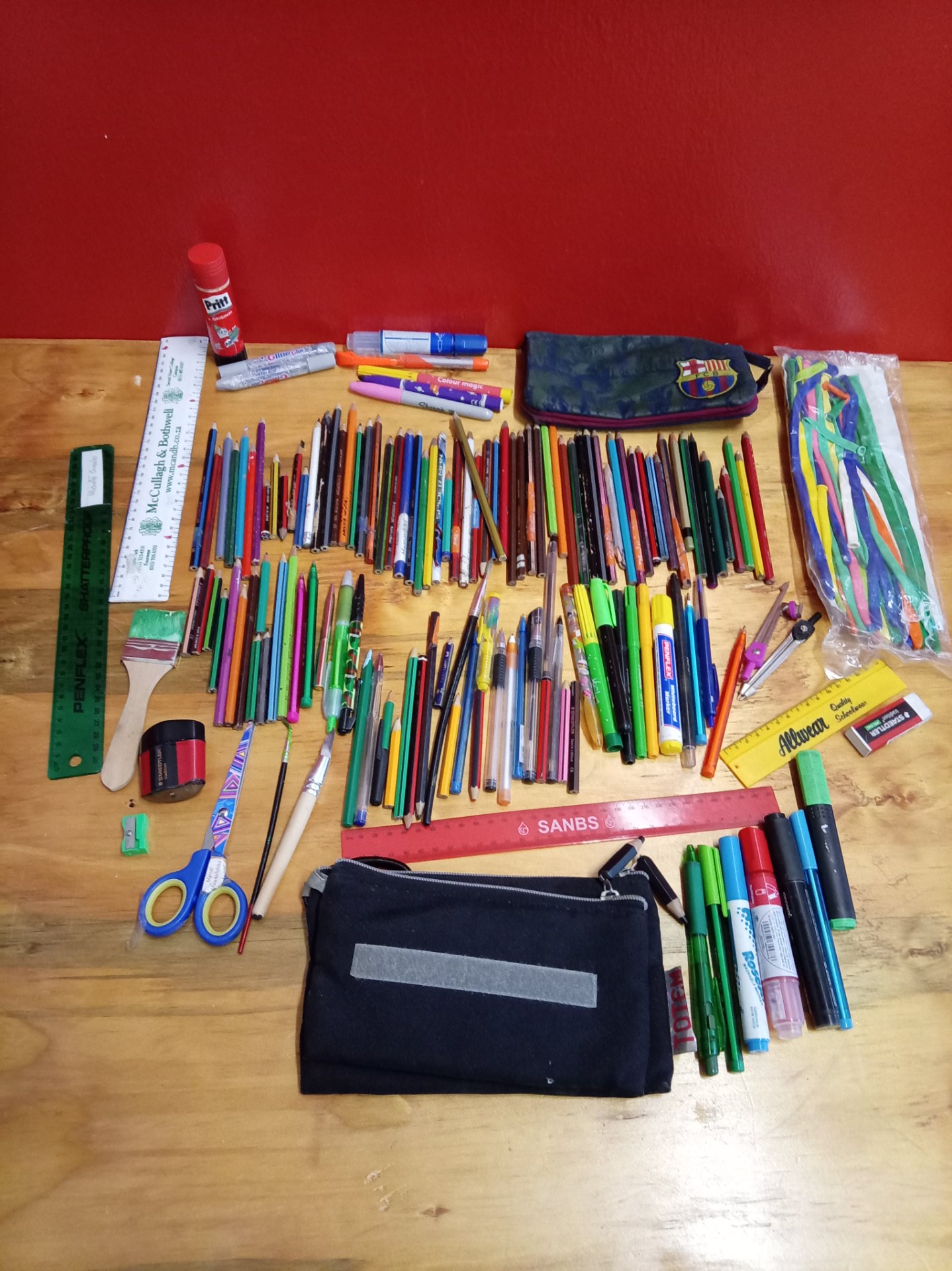 Mixed used school & art stationery lot — pencils, coloured pencils, pens, markers, rulers, glue, cases