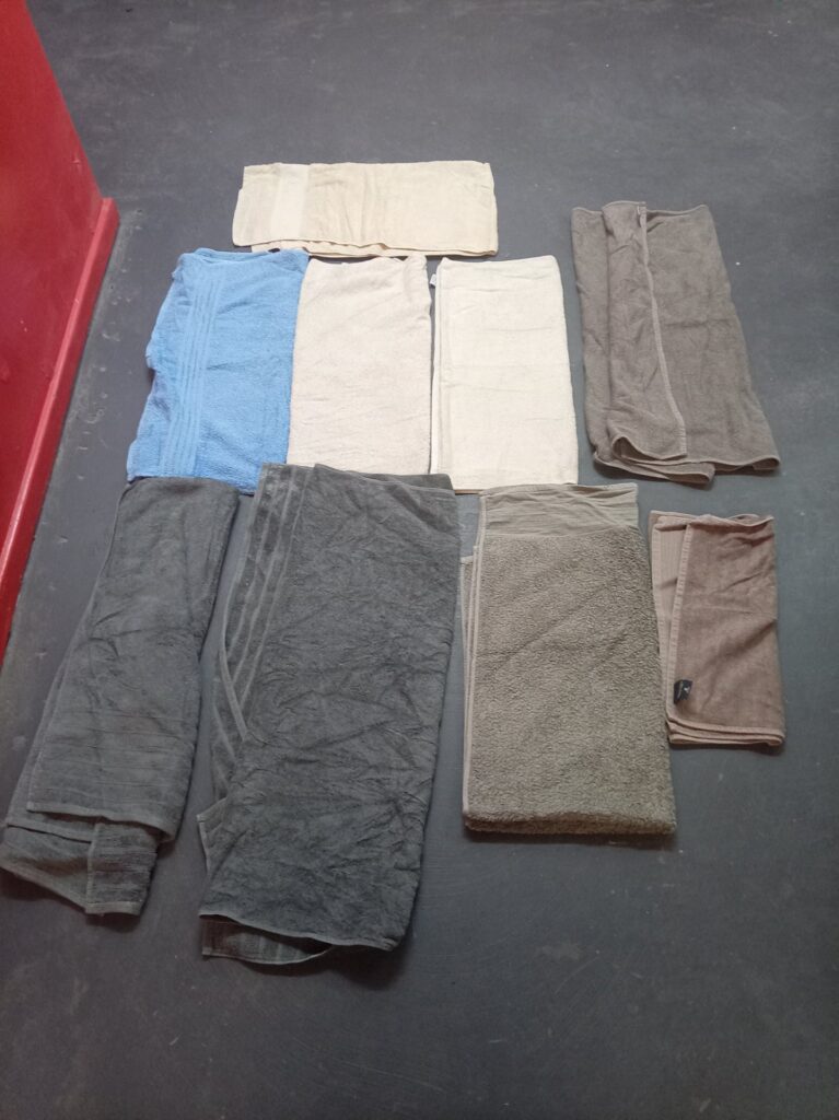 Lot of 9 Assorted Used Towels — Bath & Hand, Mixed Colours, Light Wear & Stains