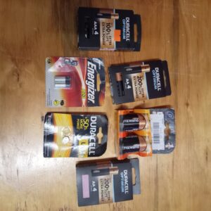 Mixed lot of Duracell & Energizer packaged batteries — AAA, D, LR44 coin & A23 (some packs opened / some cells missing)