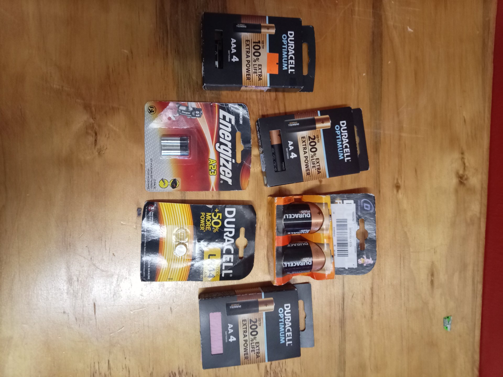 Mixed lot of Duracell & Energizer packaged batteries — AAA, D, LR44 coin & A23 (some packs opened / some cells missing)