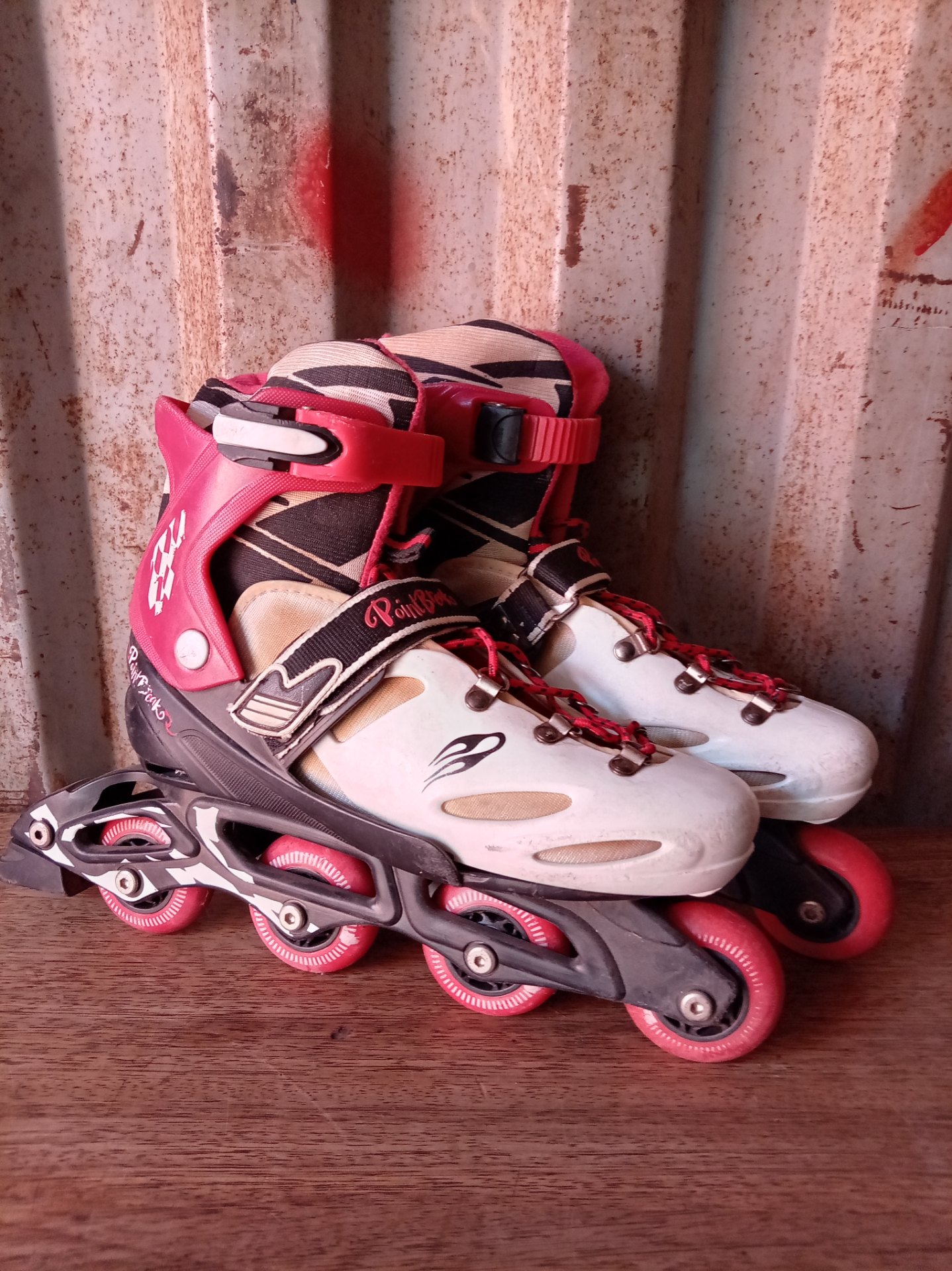 Point Break inline skates (pair) — labelled UK 4-6, used with worn wheels and rear brake