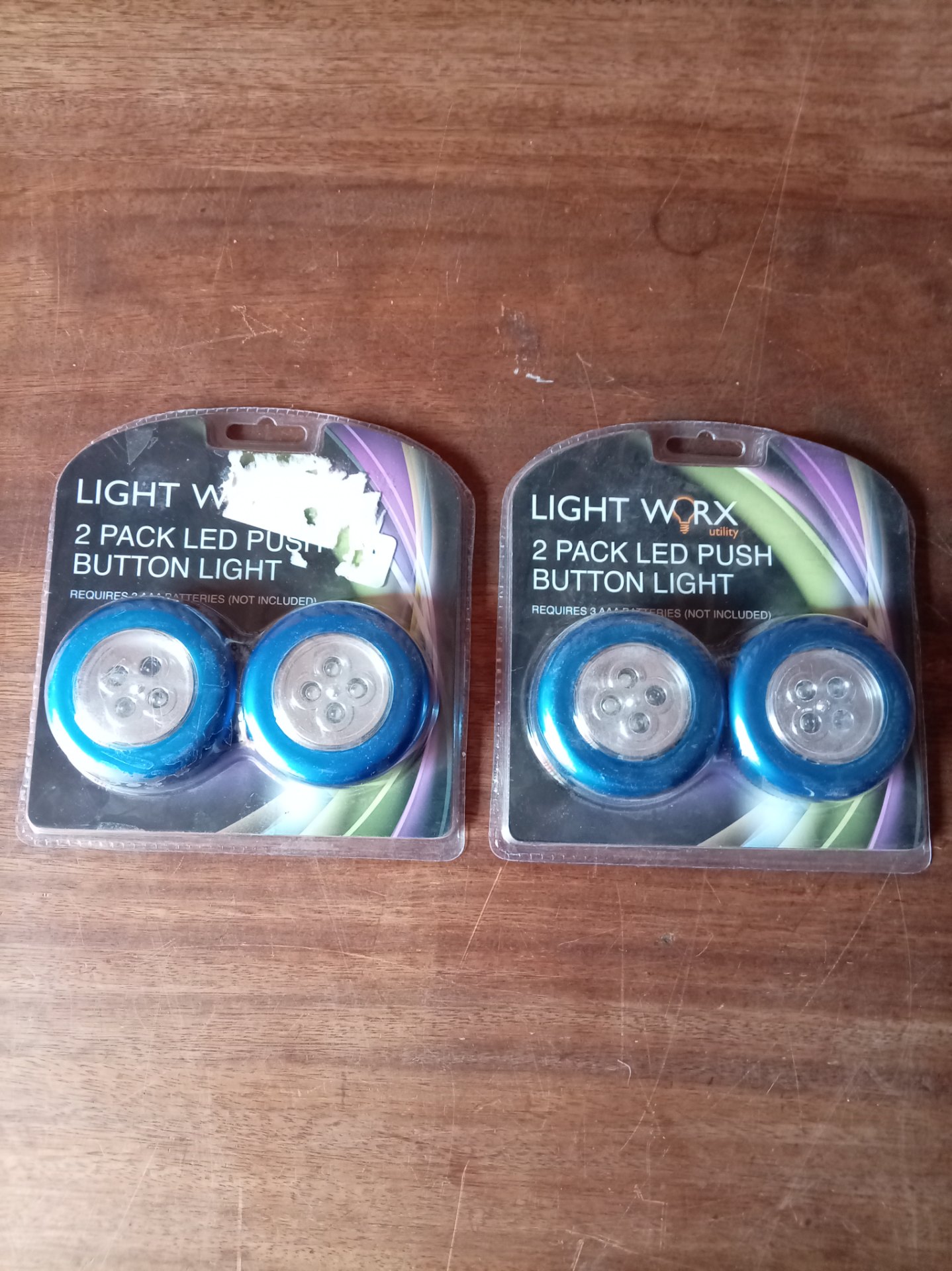 Light Worx — Two sealed 2‑Pack LED Push Button Lights (4 blue lights total) — Brand New, shelf‑worn packs