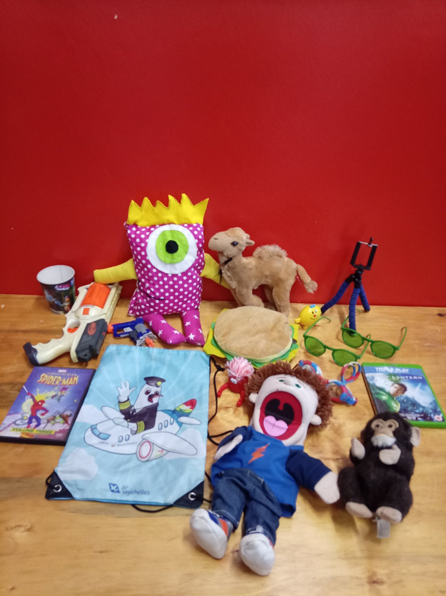 Mixed children’s toys lot — plushes, Nerf-style blaster, DVDs & novelties (used, untested)