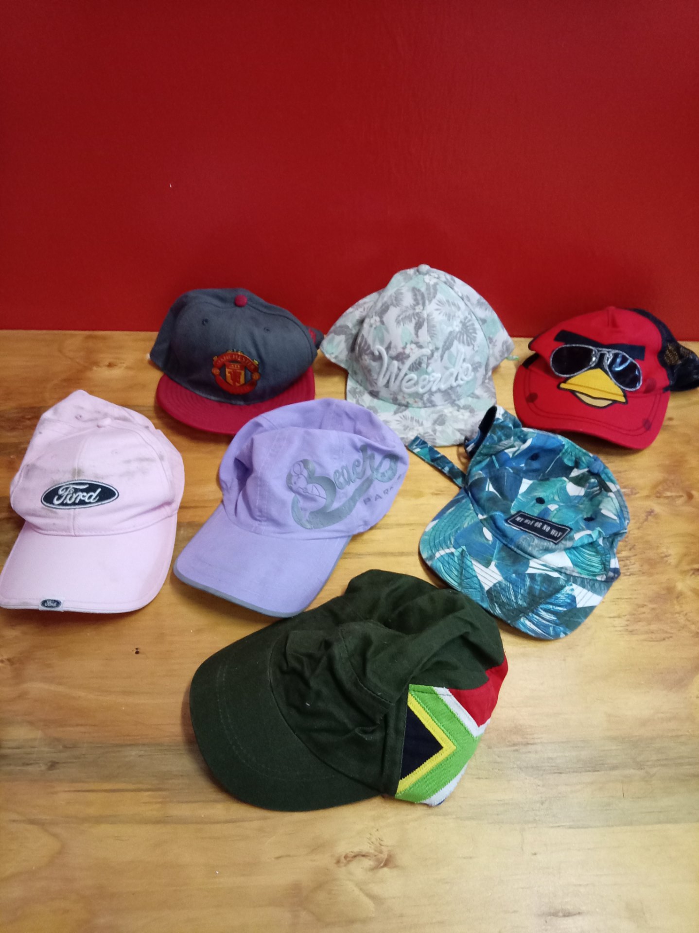 Lot of 7 casual baseball caps — mixed branded & character designs (used, visible wear)