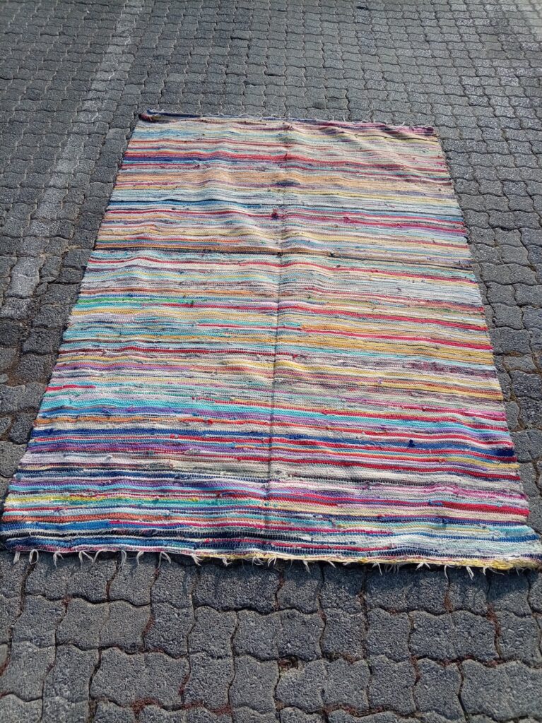Colourful striped flatweave rag rug — large single runner, used condition, frayed edges & holes