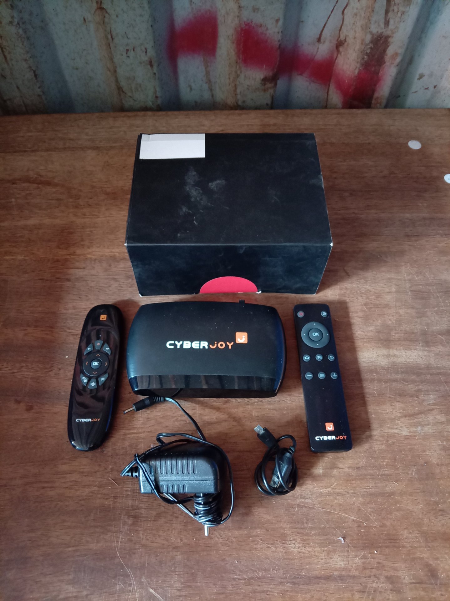 Cyberjoy Android TV streaming box with two remotes, power adapter & micro-USB — Untested