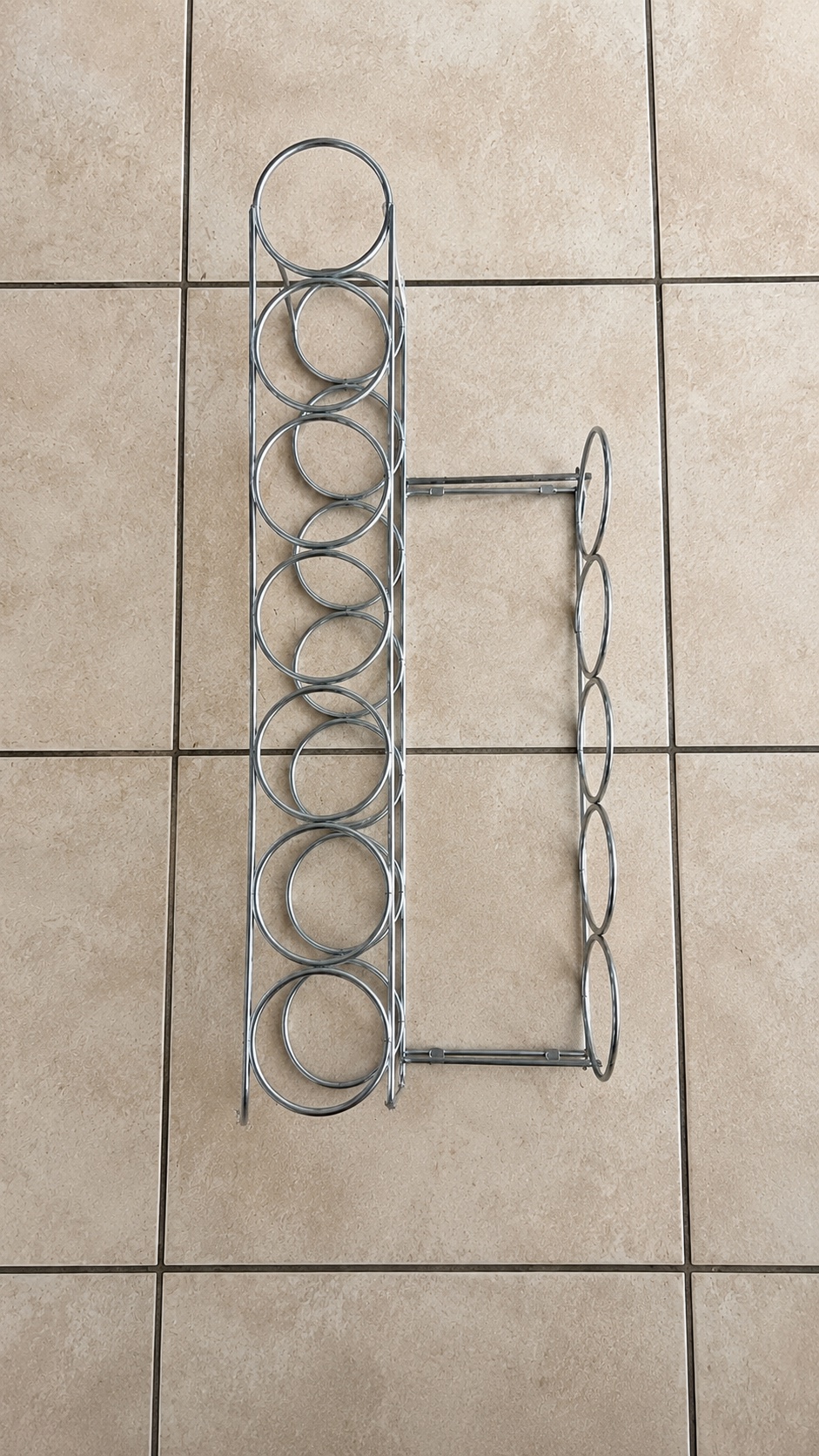 Chrome metal wine bottle rack — two-section design, circular bottle holders, used with light surface wear