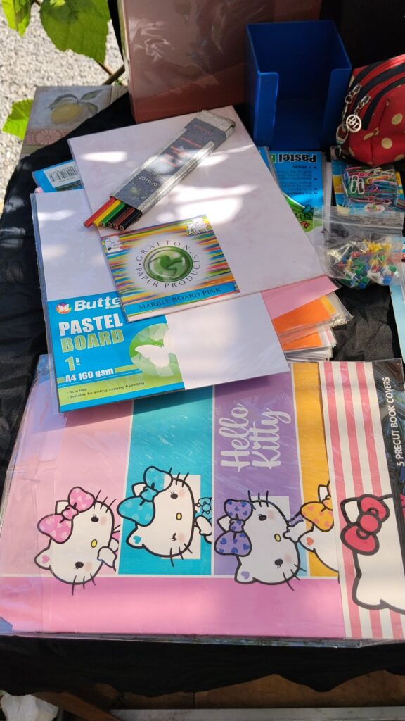 Mixed stationery lot — approx. 50 items: calculators, scissors, staplers, folders, pens, pockets & more (some new sealed)