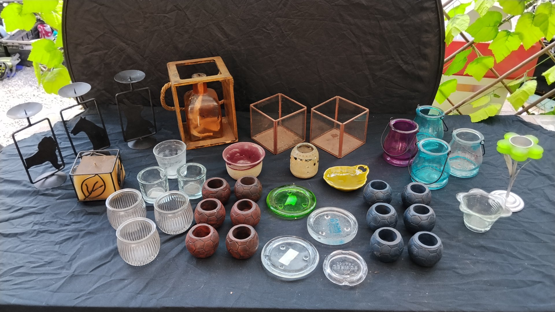 Assorted decorative candle & tealight holders, glass jars and small pots — mixed lot (approx. 36–38) — used, wax residue, some chips