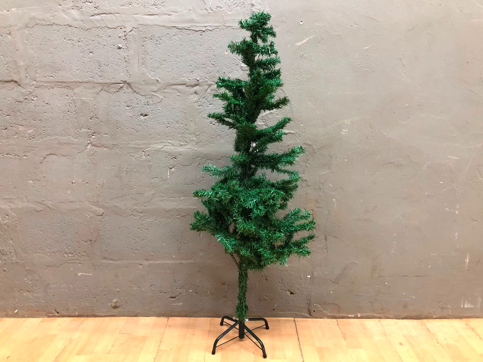 Small 131 cm Artificial Christmas Tree on Metal Stand — Fair, Sparse Foliage, No Lights