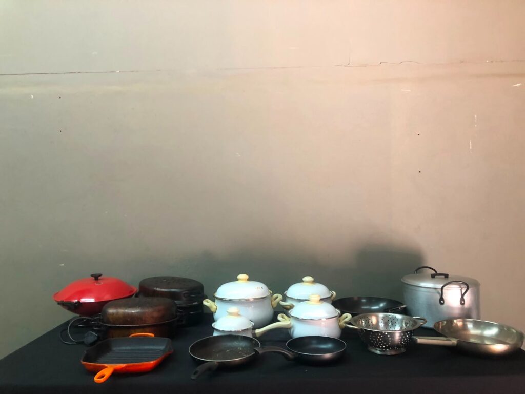 Mixed kitchen cookware lot — 14 pieces (pots, pans, colander) with Sunbeam electric grill (EWK05); heavy wear, one electric pot not working