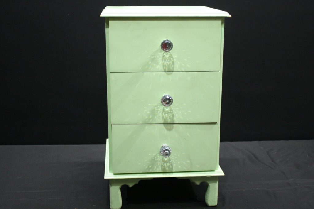 Mint-green painted small chest of drawers / jewellery box — 4 drawers, crystal-style knobs, visible paint chips