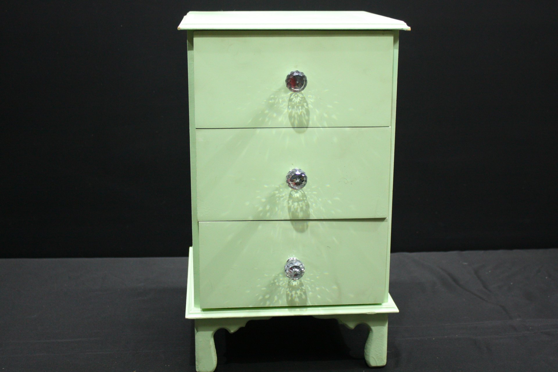 Mint-green painted small chest of drawers / jewellery box — 4 drawers, crystal-style knobs, visible paint chips