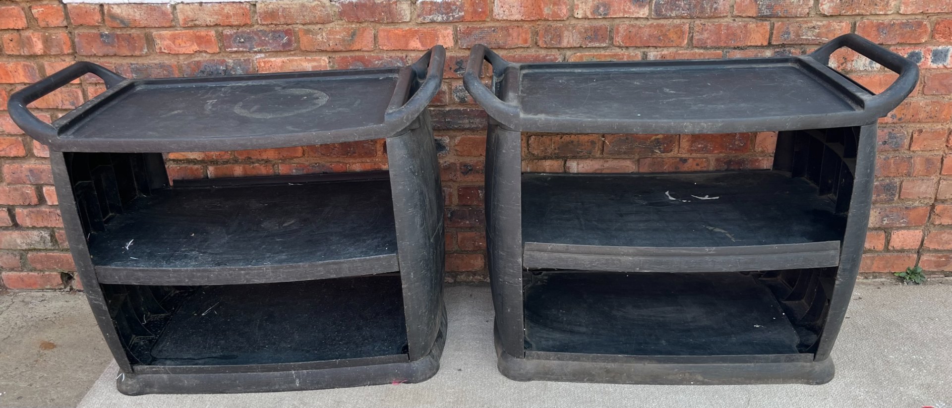 Pair of Carlisle black moulded 3-shelf service carts — missing wheels, needs TLC