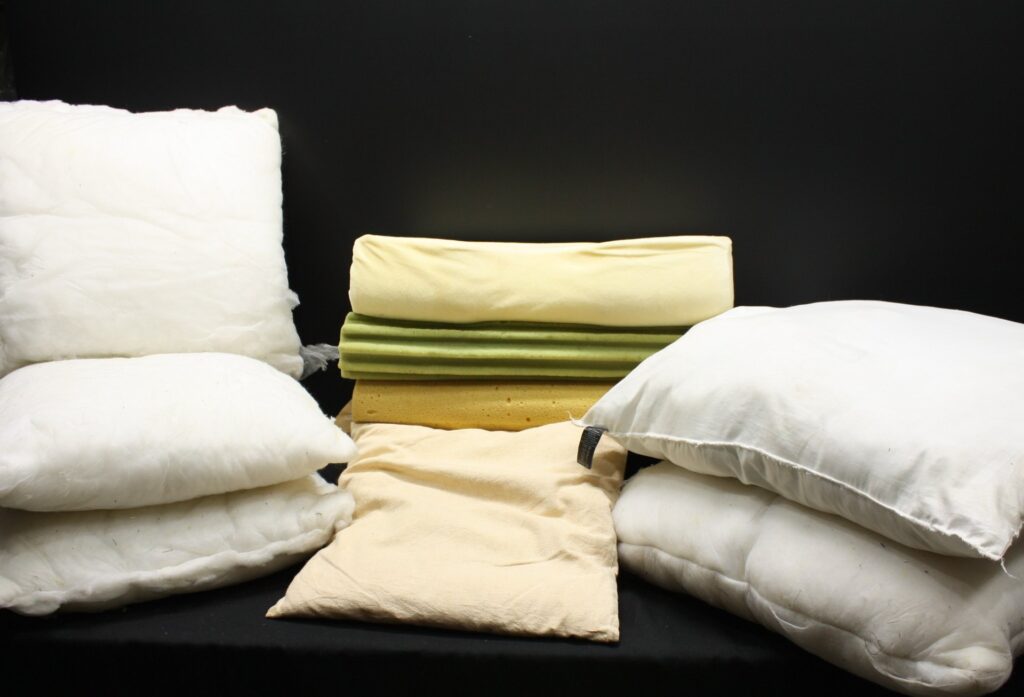 Mixed lot of assorted pillows, pillow inners and foam inserts (used) — contoured & ribbed foam visible