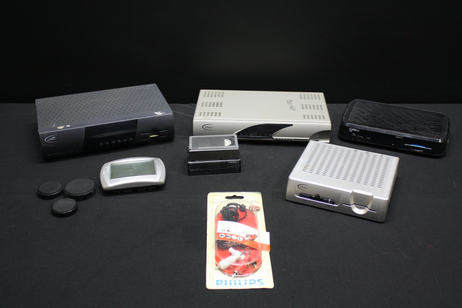 Mixed lot of DStv / MultiChoice satellite decoders + small electronics (untested) – sold as-is