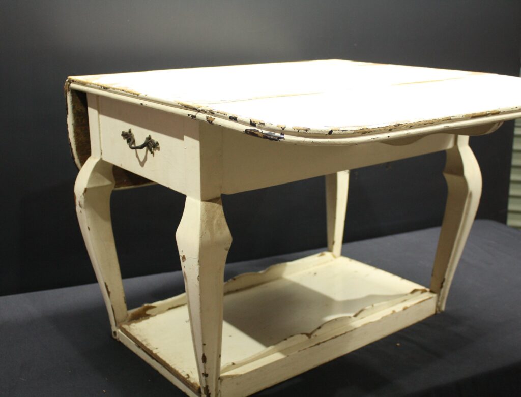 Small drop-leaf occasional/side table with drawer and lower shelf — heavy paint wear