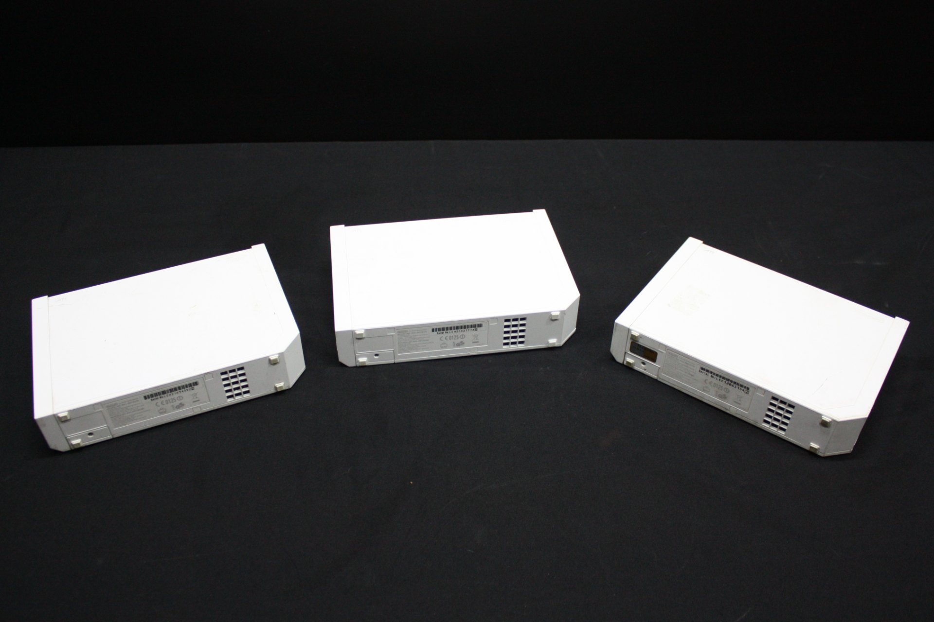 Lot of 3 Nintendo Wii consoles (model RVL-001) — used, heavy cosmetic wear, untested