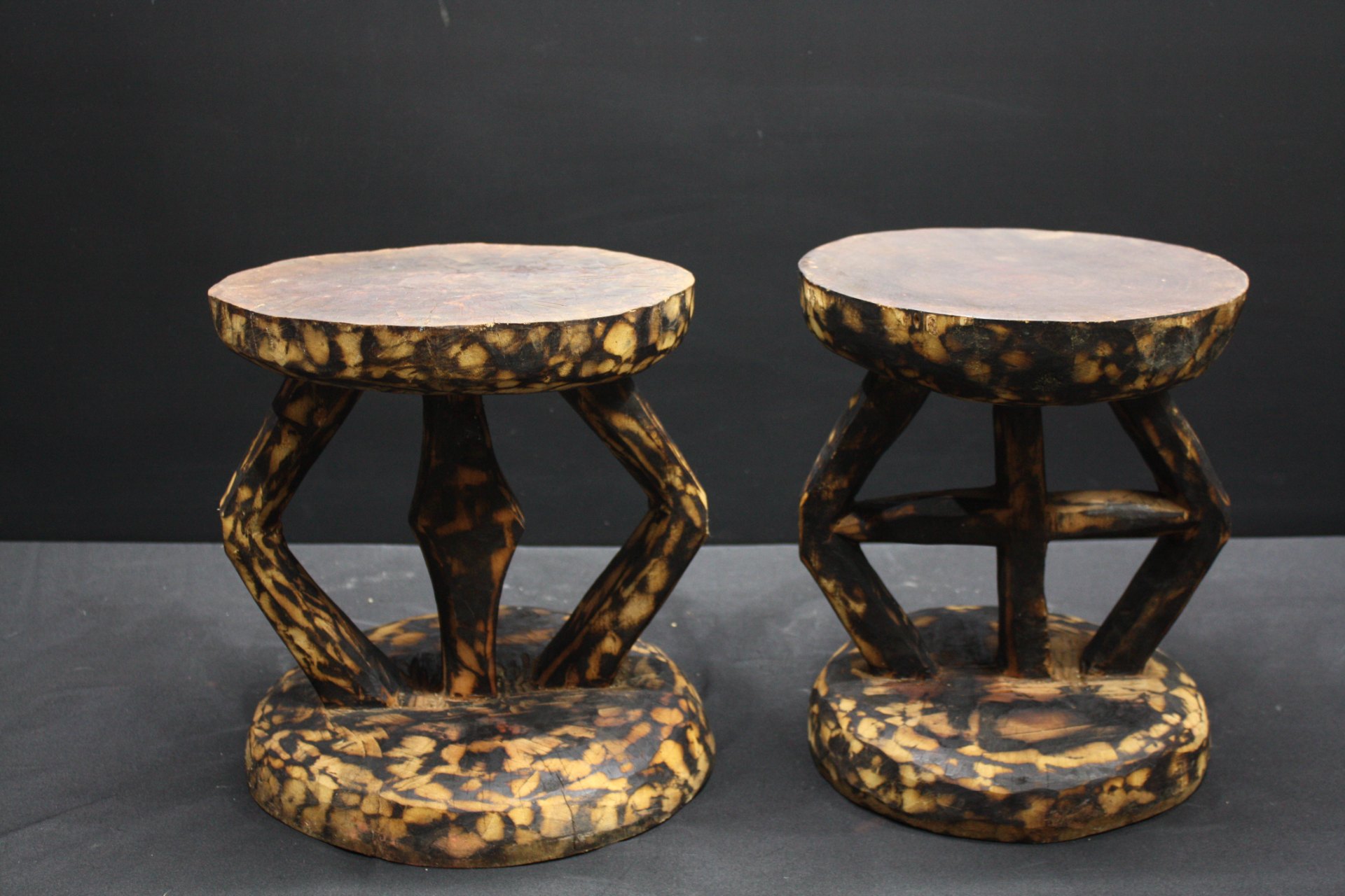 Pair of Carved Wooden Low Stools / Footstools – Spotted / Burnt Finish, Worn Patina