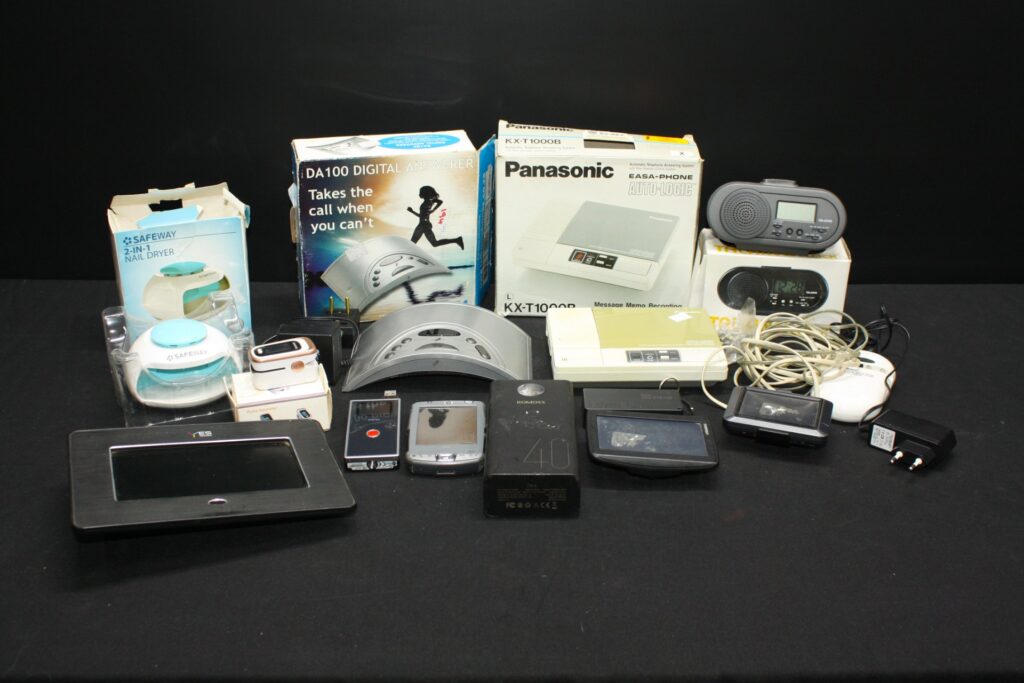 Mixed lot of used small electronics — Panasonic answering machine boxes, power banks, chargers, pulse oximeter, digital frame & more (Untested, As Is)