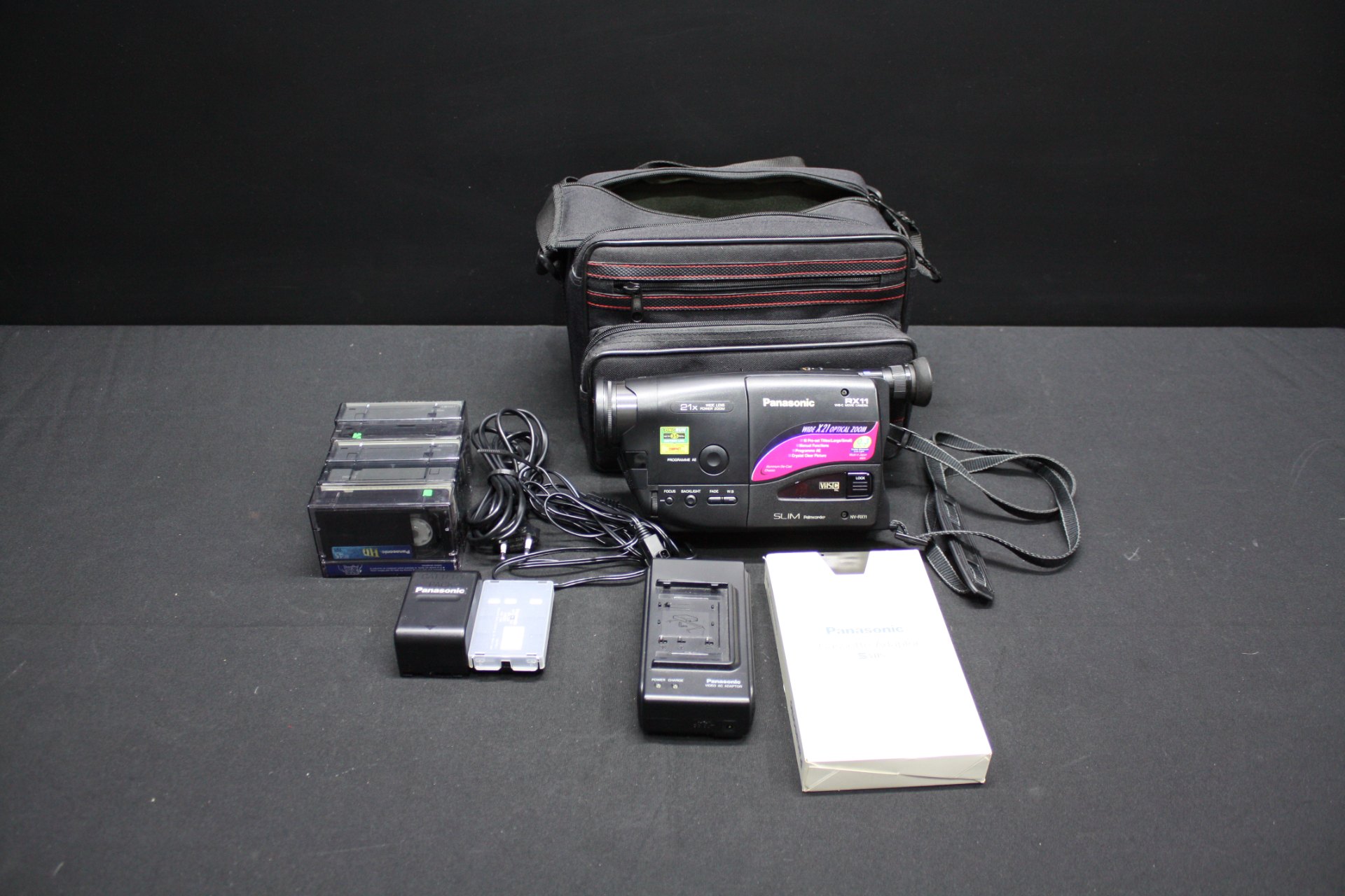Panasonic NV-RX11 VHS-C camcorder with charger, battery, boxed cassette adaptor, 4 VHS-C tapes, manual & carry bag (Untested)