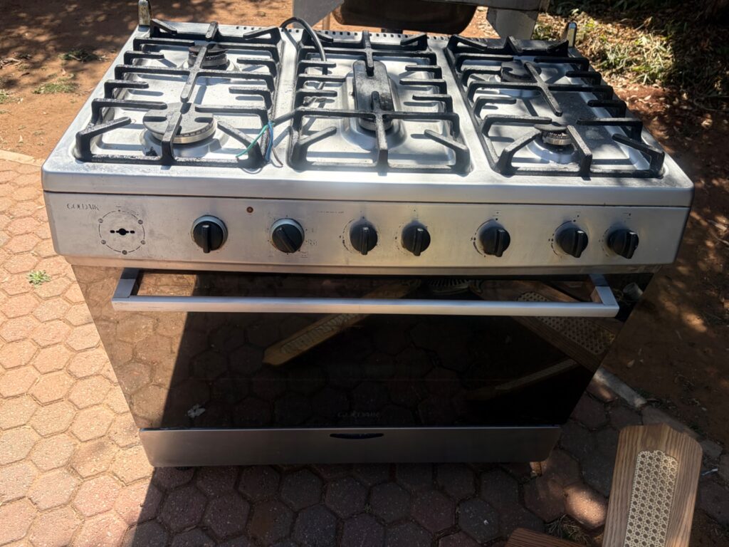 Goldair 6-burner freestanding cooker with oven — stainless-look, cast-iron grates, LPG inlet