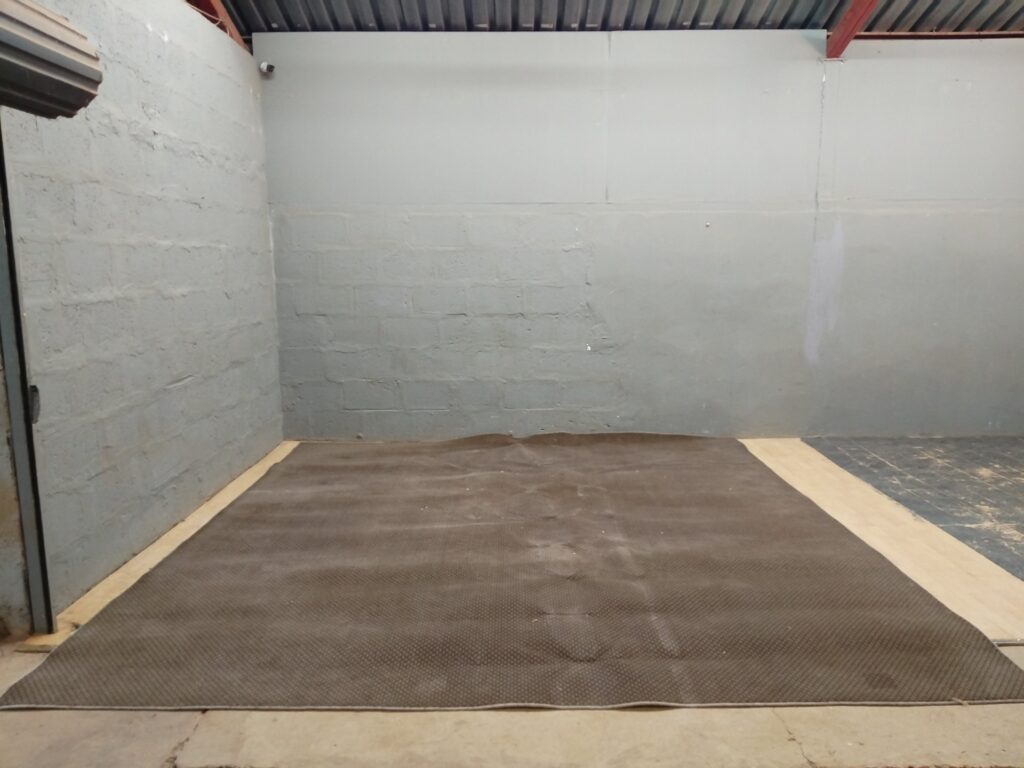 Large brown patterned area carpet / rug – 365 x 380 cm (full piece) — used, soiled, backing shown