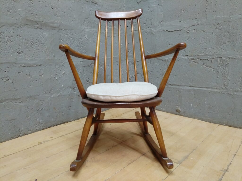 Wooden spindle-back rocking chair with removable cushion