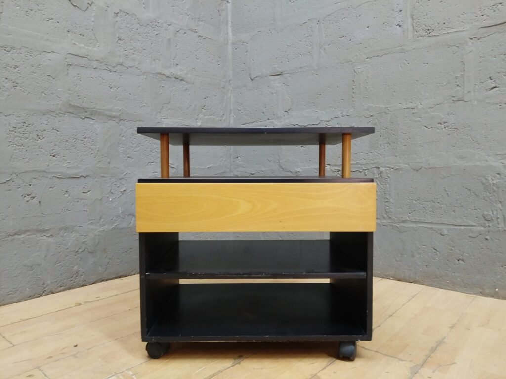 Small wheeled shelving trolley with drawer — two shelves, castors, minor wear (48 x 64 x 65 cm)