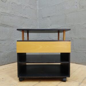 Small wheeled shelving trolley with drawer — two shelves, castors, minor wear (48 x 64 x 65 cm)