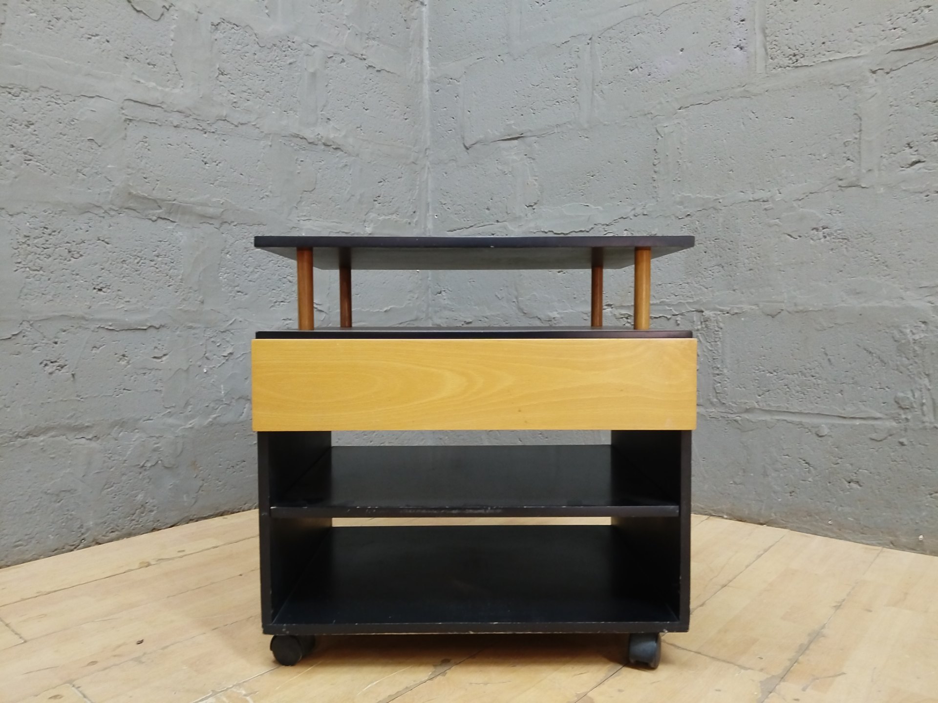 Small wheeled shelving trolley with drawer — two shelves, castors, minor wear (48 x 64 x 65 cm)