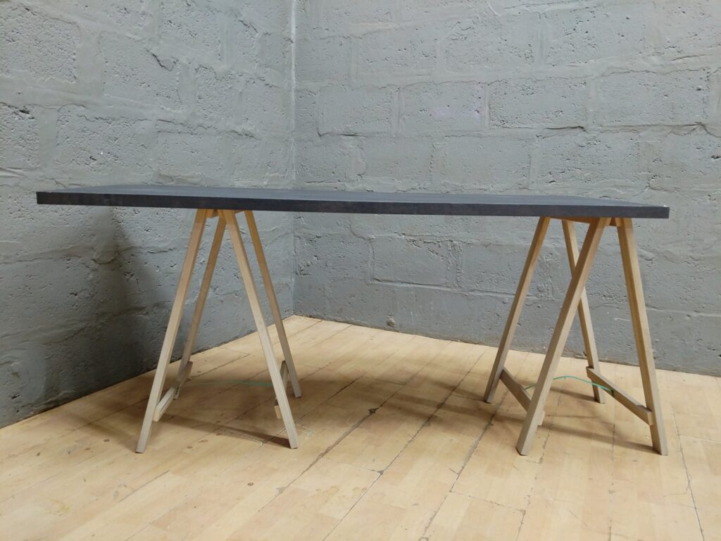 Dark laminate tabletop panel 167 × 61 × 77 cm — fair condition, edge chips