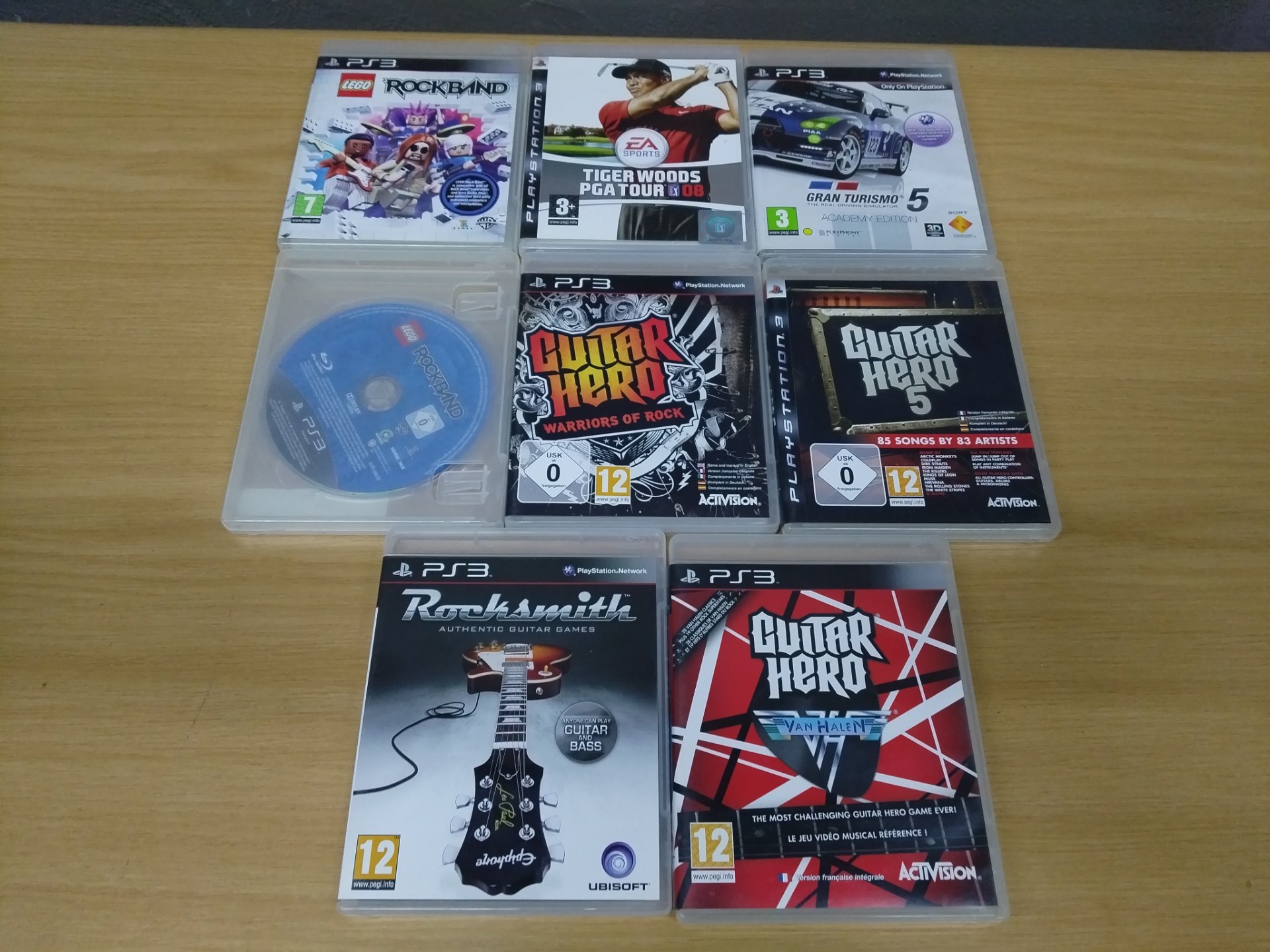 Lot of 8 PlayStation 3 (PS3) Game Discs in Slim Cases – Rocksmith, Guitar Hero titles, Lego Rockband, Gran Turismo 5, Tiger Woods PGA Tour 08