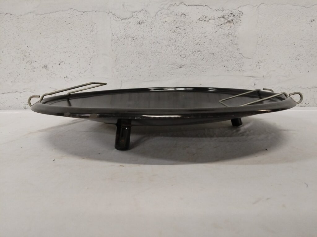 Black enamel three‑leg trivet / gas burner plate with two removable wire pot rests
