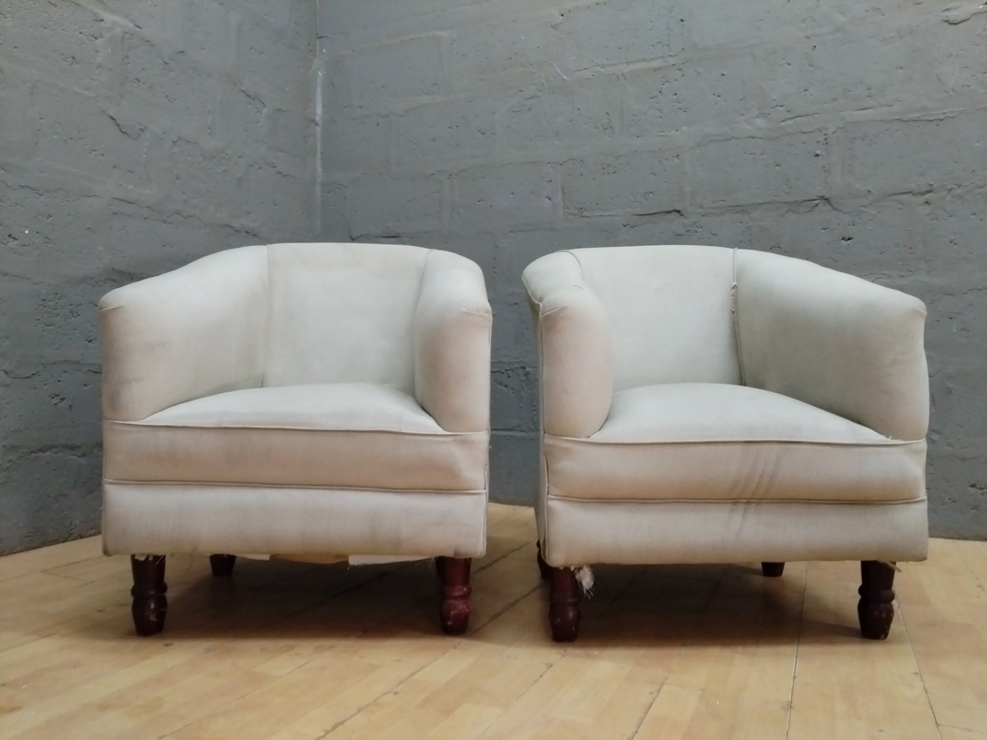 Pair of Beige Upholstered Tub / Club Chairs — Used, Stains & Tears, Turned Wooden Legs (71 x 65 x 87cm each)