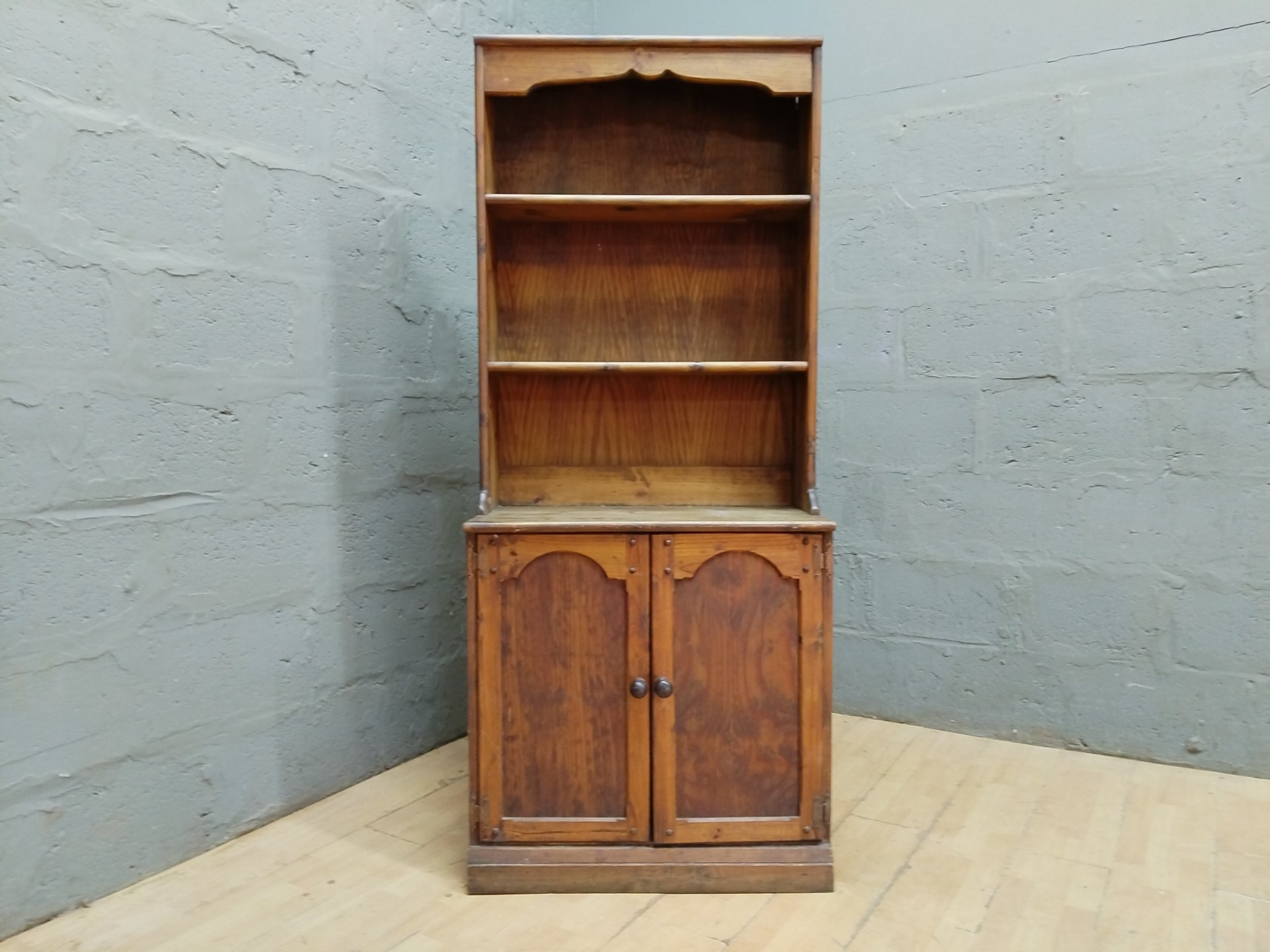 Tall timber dresser / open bookcase with lower two-door cupboard