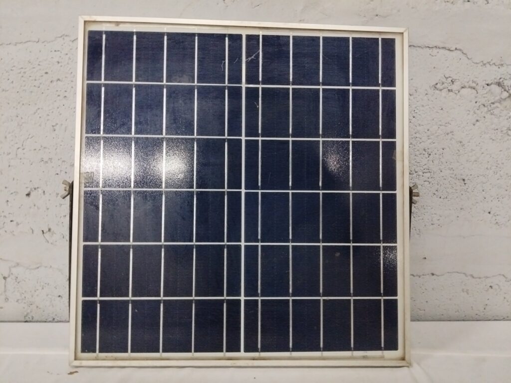 Small polycrystalline solar panel with junction box & cable — used, surface cracks & frame corrosion