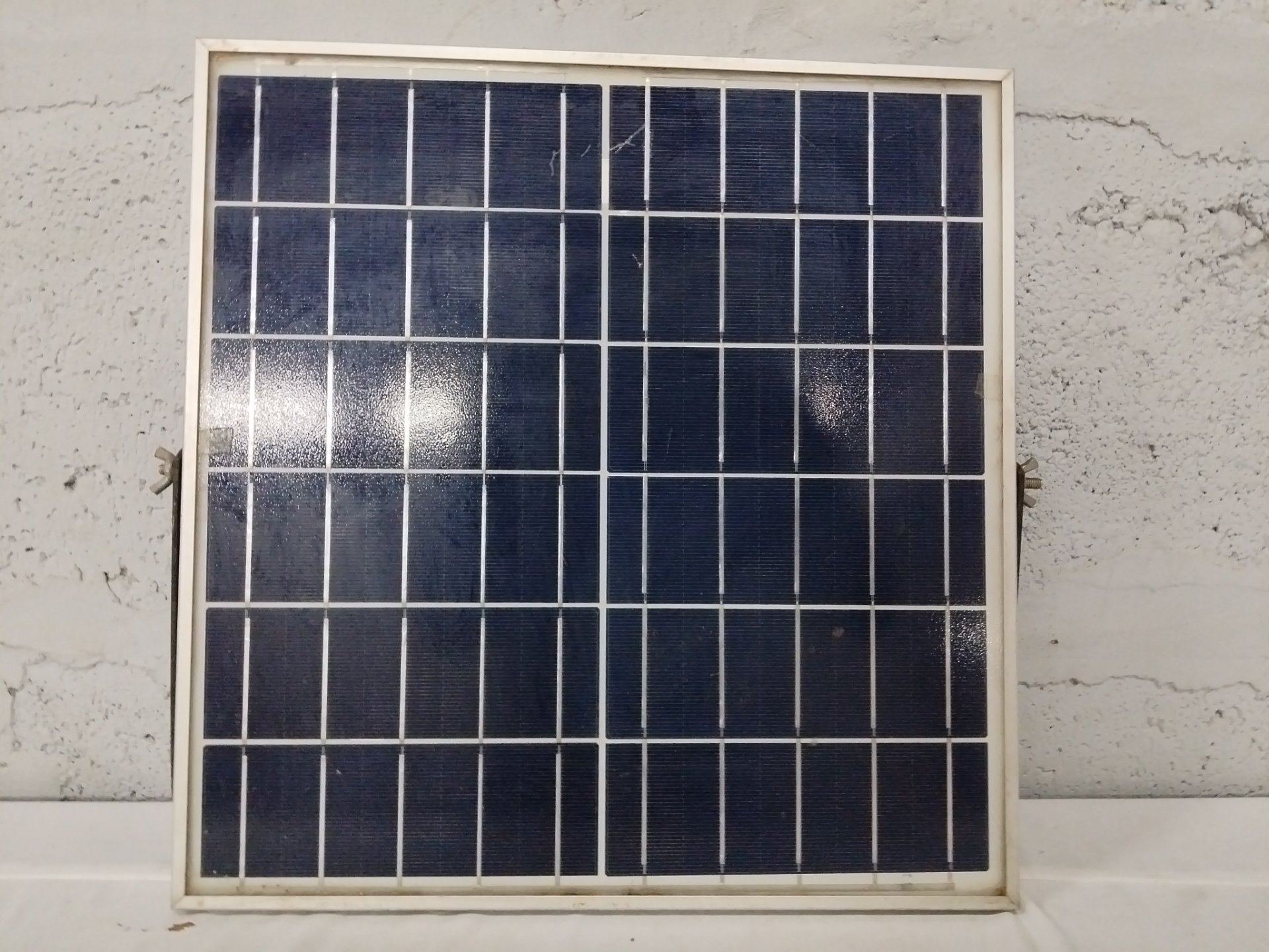Small polycrystalline solar panel with junction box & cable — used, surface cracks & frame corrosion