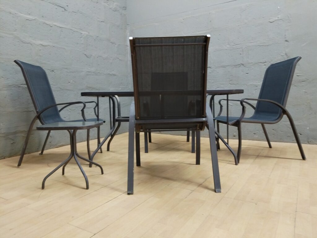 Outdoor 5-piece patio dining set — glass-top table, 4 sling chairs + small side/footstool