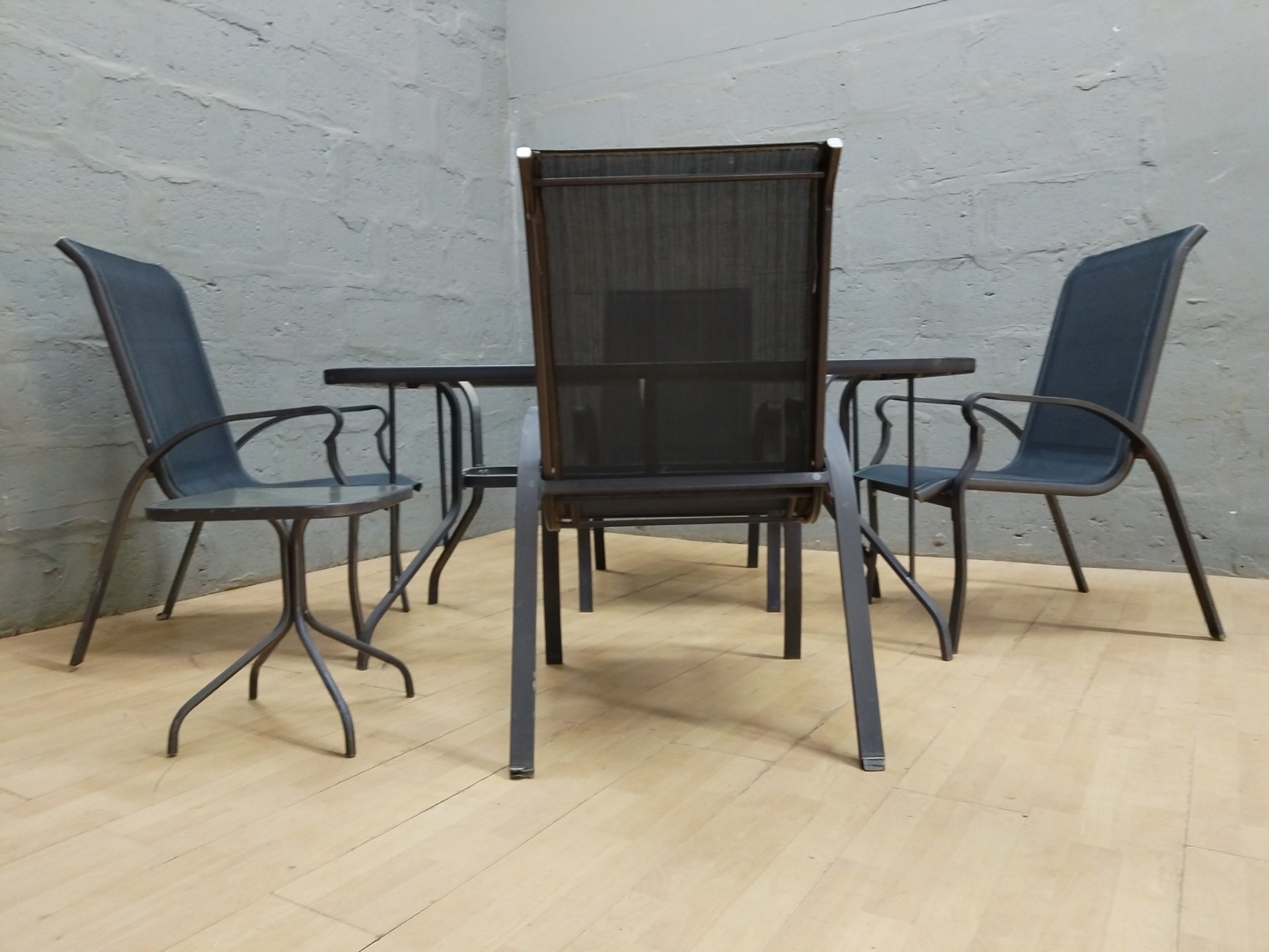 Outdoor 5-piece patio dining set — glass-top table, 4 sling chairs + small side/footstool